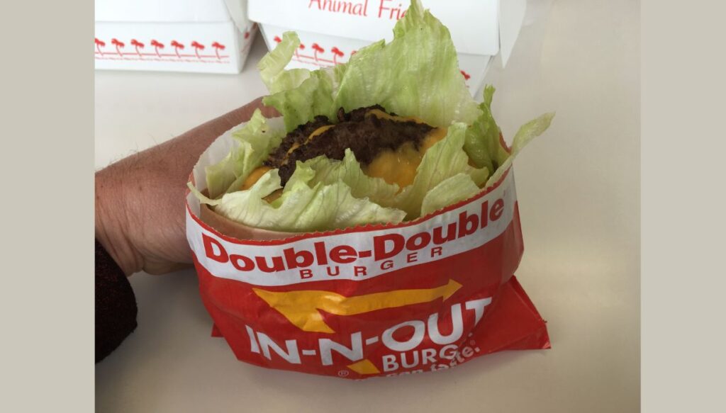 Protein style burger with cheese and wrapped with lettuce.