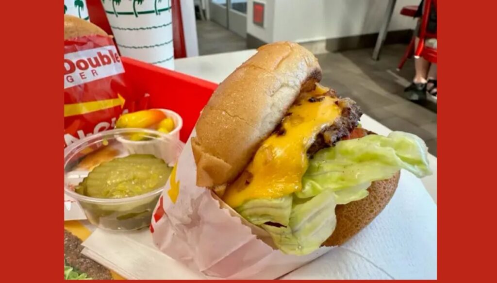 Animal Style Cheeseburger is served with extra cheese and pickles.